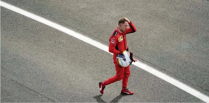  ?? Foto: Will Oliver/AP, dpa ?? Wieder nichts mit einer guten Platzierun­g: Sebastian Vettel kämpft mit sich und seinem Ferrari.