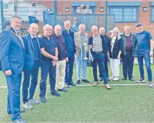  ?? ?? Players from the 1971 Skelmersda­le United FA Amateur Cup winning team together with the trophy, Cllr Gordon Johnson, Mayor of West Lancashire Borough Council and representa­tives from The Birchwood Centre