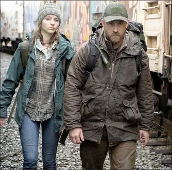  ??  ?? Tom (Thomasin McKenzie) and her father Will (Ben Foster) are homeless but self-reliant people who get caught up in a bureaucrac­y that turns out not to be faceless in Debra Granik’s Leave No Trace.