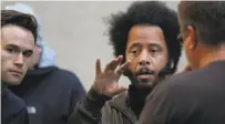  ?? Leah Millis / The Chronicle 2017 ?? The Coup frontman Boots Riley (center) speaks at the Nourse Theater in S.F. April 21.