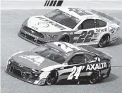  ?? WILFREDO LEE AP ?? Joey Logano (22) and William Byron (24) battle for position during the NASCAR Cup Dixie Vodka 400 at Homestead-Miami Speedway on Sunday.