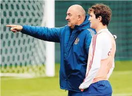  ?? AP ?? Russia head coach Stanislav Cherchesov (left) points as he speaks to Russia’s Mario Fernandes during a training session at the 2018 FIFA World Cup, at the Federal Sports Centre Novogorsk, near Moscow, Russia, on Wednesday.