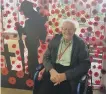  ??  ?? Bill Tutty in front of the poppy display and soldier cut-out