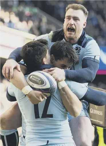  ??  ?? 0 Stuart Hogg and Sam Johnson engulf Sean Maitland after the winger scored just before half-time.