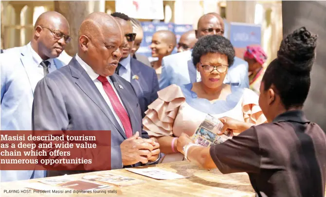  ?? ?? PLAYING HOST: President Masisi and dignitarie­s touring stalls