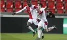  ??  ?? Slavia’s Nicolae Stanciu, right, celebrates scoring the opener. Photograph: Petr David Josek/AP