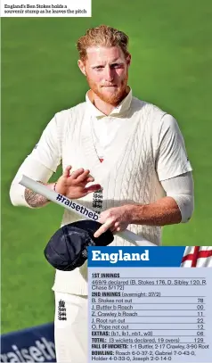  ??  ?? England’s Ben Stokes holds a souvenir stump as he leaves the pitch