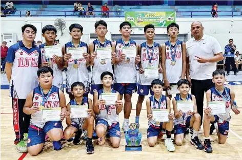  ?? (Eugene Chua photo) ?? The Iloilo City elementary boys basketball team earned the right to represent Western Visayas in the 2024 Palarong Pambansa in Cebu City this July, after they clinched the crown in the 2024 WVRAA Meet.