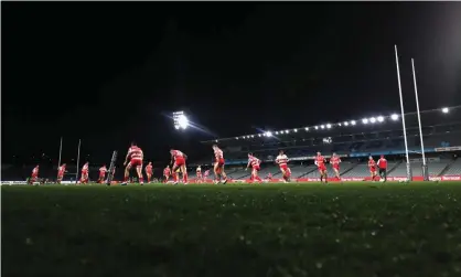  ?? Photograph: Ashley Feder/Getty Images ?? Dragons players warm up on Friday night ahead of their clash with the New Zealand Warriors at Gosford. Authoritie­s are investigat­ing if some players breached health orders on Saturday night.