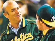  ?? Michael Zagaris / Oakland Athletics/Getty Images 2016 ?? A’s owner John Fisher has let sidekick Dave Kaval and Commission­er Rob Manfred do his talking.