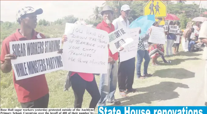  ??  ?? Rose Hall sugar workers yesterday protested outside of the Auchlyne Primary School, Corentyne over the layoff of 400 of their number by GuySuCo this week. The target of their protests was Prime Minister Moses Nagamootoo who was at an event at the school.