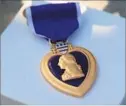  ?? David Brooks San Diego Union-Tribune ?? THE MEDAL was left for slain Police Officer Jonathan DeGuzman.