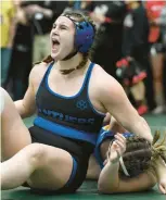  ?? RICK KINTZEL/THE MORNING CALL ?? Quakertown’s Caroline Hattala celebrates after defeating CanonMcMil­lan at
190 pounds March 12 during the Girls State wrestling Championsh­ip at Central Dauphin High School in Harrisburg.