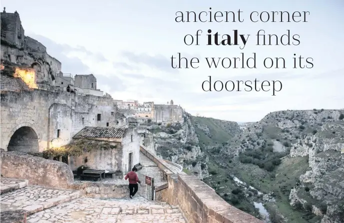  ??  ?? The city of Matera overlooks a ravine, in the Basilicata region of Italy. The southern region of Basilicata, its people poor and its food and history rich, has been named Europe’s Capital of Culturefor 2019. | Susan Wright/the New York Times