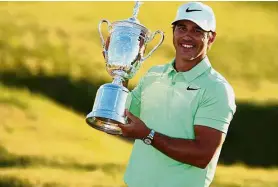  ??  ?? Major win: American Brooks Koepka celebratin­g after winning the US Open title in June.