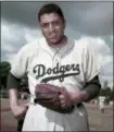  ?? THE ASSOCIATED PRESS ?? Brooklyn Dodgers’ pitcher Don Newcombe. Newcombe was one of the first black players in the major leagues and went on to win the rookie of the year, Most Valuable Player and Cy Young awards.