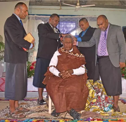  ?? Photo: Waisea Nasokia ?? Turaga ni Yavusa Joape Nabure is blessed by pastors at the Drauniivi Seventh-day Adventist Church in Ra on May 19, 2022.