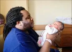  ?? Dan Gigler/Post-Gazette ?? Jaymes Powell, 26, of Beltzhoove­r holds his daughter, Veronica, at West Penn Hospital.