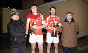  ??  ?? Liam Sayers Chairman of St Brendans Football Board, presentin David O’Callaghan Capt St Pats with the Lee Starnd Cup after his team defeated churchill in the Lee Strand St Brendan’s Football Board, on Saturday evening and also Mike Morioarty of St Brendan’s Football Board, presenting Eoin Greaney St Pats with the man of the match Trophy at Caherslee GAA grounds on Satutrday evening