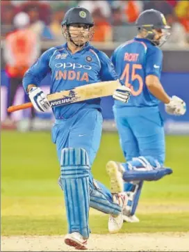  ?? AFP ?? India wicketkeep­er MS Dhoni (left), who has dropped a few catches at the ongoing Asia Cup, will turn 38 during next year’s World Cup.