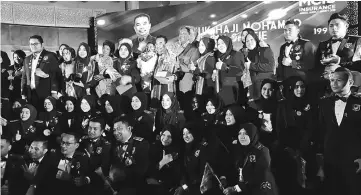  ??  ?? Datuk Haji Mohamad Fazil (standing first row, fifth left) in a photo call with his team.