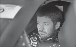  ?? John Cole / The Associated Press ?? Martin Truex Jr. waits in his car during Friday’s practice for Sunday’s NASCAR Sprint Cup Series race at New Hampshire Motor Speedway in Loudon, N.H.