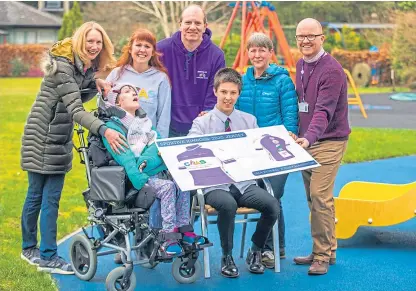  ?? Picture: Steve MacDougall. ?? Marion and Isla Riddell, Lyndsay Stobie, Jeff Wall of Sportive Kinross, Rory Maddocks, Dr Jane Timperley (Rory’s mum and Kinross Cycling Club president), and Stuart McDonald (Kinross High School CDT teacher) with the design for the jersey.