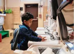  ?? New York Times file photo ?? Top: Students arrive for the first day of school Wednesday in San Francisco. Above: Hand-washing and other COVID-related precaution­s also help prevent the spread of monkeypox.