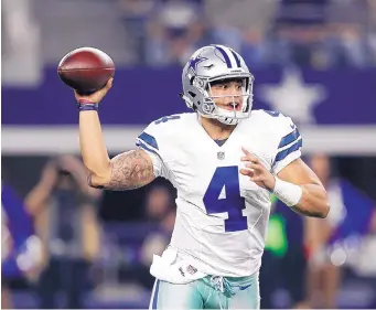  ?? BRANDON WADE/AP FILE ?? Dallas Cowboys rookie quarterbac­k Dak Prescott was not the top choice to be Tony Romo’s backup last offseason. But he has become much more for the franchise.