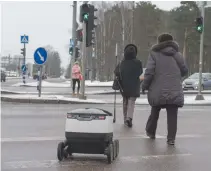  ??  ?? A SIX-WHEELED robot by Starship Technologi­es makes its way to deliver food from restaurant in Tallinn, Estonia on Feb. 16.