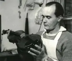  ??  ?? Inspecting a violin in the 1950s