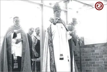  ??  ?? The Bishop of Dover Lewis Meredith blesses the new church hall in the presence of the Rev E. B. Lewis, Vicar of Kennington