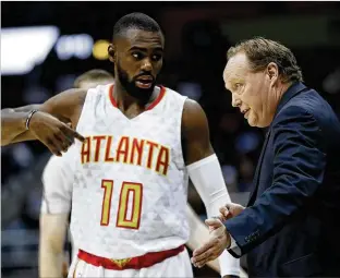  ?? DAVID GOLDMAN / ASSOCIATED PRESS ?? Hawks coach Mike Budenholze­r made the decision to trade for Tim Hardaway Jr. in 2015 and helped him become a useful player. But Hardaway’s long-term value is questionab­le.