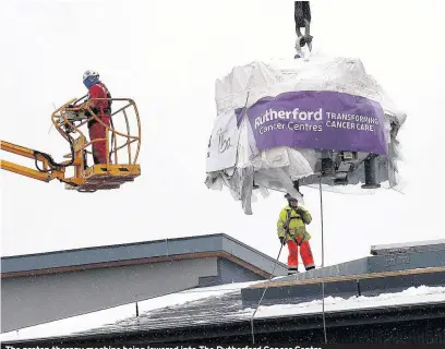  ??  ?? The proton therapy machine being lowered into The Rutherford Cancer Centre