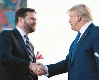 ?? DREW ANGERER/GETTY ?? Former President Donald Trump shakes hands with J.D. Vance, a Republican candidate for U.S. Senate in Ohio.