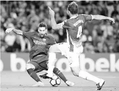  ??  ?? Barcelona’s Argentinia­n forward Lionel Messi (L) shoots to score next to Espanyol’s midfielder Victor Sanchez during the Spanish Liga football match Barcelona vs Espanyol at the Camp Nou stadium in Barcelona on September 9, 2017. - AFP photo