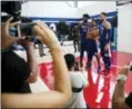  ?? MATT ROURKE — THE ASSOCIATED PRESS ?? The 76ers’ Joel Embiid (21), Markelle Fultz, center, and Ben Simmons (25) pose for a photograph during media day Monday in Camden, N.J.