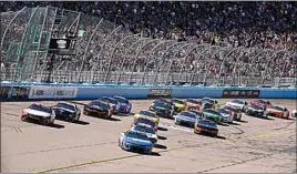  ?? DARRYL WEBB / AP ?? Cars take the starting flag during the NASCAR Cup Series auto race at Phoenix Raceway on Sunday in Avondale, Ariz.