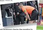  ?? ?? VAR REACHING Davidvid Dickinson checks the monitor to award Celtic a spot-kick against St Mirren earlier this month and Well’s Theo Bair was judged guilty of hand ball after deflected ball hit off him against Dons last weekend