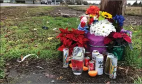  ?? AP PHOTO BY ANDREW SELSKY ?? Flowers, candles, and other objects are shown at a memorial, Thursday, Dec. 12, at the scene where three Christmas tree farm workers from Guatemala were killed and others were injured in a van crash on Nov. 29, 2019 in Salem, Ore. Immigrant and worker advocates say the crash shed light on “invisible work” by immigrant workers that takes place in Oregon, which has the U.S.’S largest Christmas tree industry.
