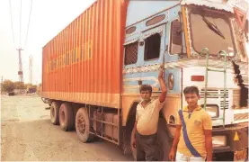 ?? PHOTO: N SUNDARESHA SUBRAMANIA­N ?? Truck drivers Nagendra (left) and Shashikant in front of a dhaba along the highway to Rajasthan