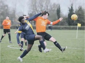  ??  ?? Action from Glinton & Northborou­gh (blue) 1, Stamford Bels Reserves 6 in the Junior Cup. Photo: David Lowndes.