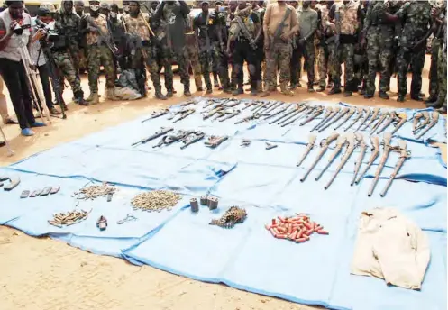  ??  ?? Guns and ammunition recovered by troops, from Zwere armed militia in Ugya of Toto LGA of Nasarawa State.