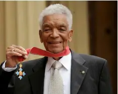  ?? Anthony Devlin/PA via AP ?? In this 2009 file photo, Earl Cameron poses for the media outside Buckingham Palace after being presented his CBE by Prince Charles, in London.