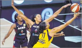  ?? Chris O’meara The Associated Press ?? A’ja Wilson of the Aces blocks a shot by Indiana Fever center Natalie Achonwa during Tuesday’s 9286 victory in Bradenton, Fla.