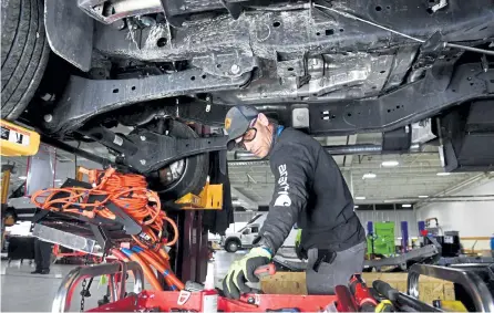  ?? Helen H. Richardson, The Denver Post ?? Assembly technician Austin Flood works on the shifter of an electric vehicle at Lightning eMotors on May 4 in Loveland.