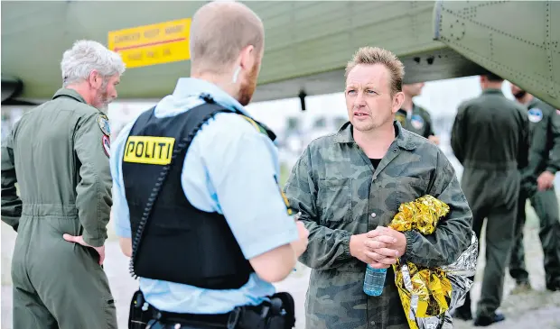  ?? BAX LINDHARDT / SCANPIX DENMARK / AFP / GETTY IMAGES ?? Peter Madsen, right, who is being held by police, has said that Kim Wall died in an “accident” aboard his submarine, before he buried her at sea.