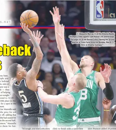  ?? AFP PHOTO ?? Dejounte Murray (5) of the Atlanta Hawks attempts a shot against Sam Hauser (30) and Kristaps Porzingis (8) of the Boston Celtics during the second quarter at State Farm Arena on Monday, March 25, 2024, in Atlanta, Georgia.