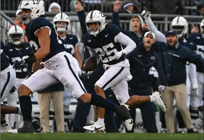  ?? BARRY REEGER / ASSOCIATED PRESS ?? Penn State punt returner Daequan Hardy (25) rumbles for a touchdown during the first half of a 63-0 rout of Massachuse­tts on Oct. 14 in State College, Pa. The seventh-ranked Nittany Lions (6-0) have won 17 of their past 19 regular-season games heading into Saturday’s matchup with No. 3 Ohio State in Columbus, Ohio.