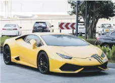  ?? Leslie Pableo for The National ?? Farah Hashi, left, received a discount on the Dh50,000 in rental fees he was charged for the time the Lamborghin­i was parked outside a hotel in Dubai, above